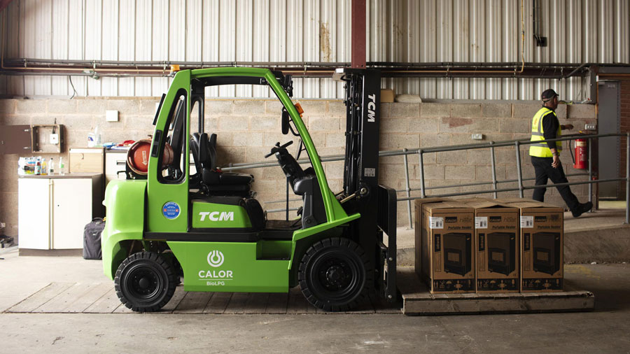 Green FLT with a Calor BioLPG logo on the side. Inside a warehouse, lifting pallets