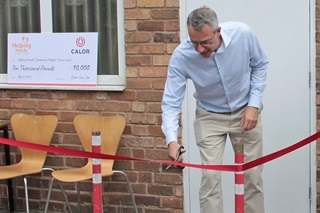 Mathew Hickin CEO of Calor cutting the ribbon of the new Helping Hands centre in Leamington