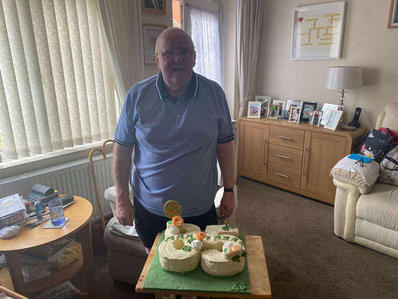 Mr Thomas with his 85th Birthday cake 