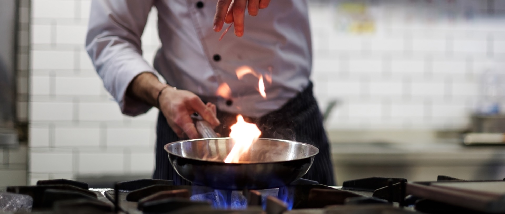 A chef cooking on gas