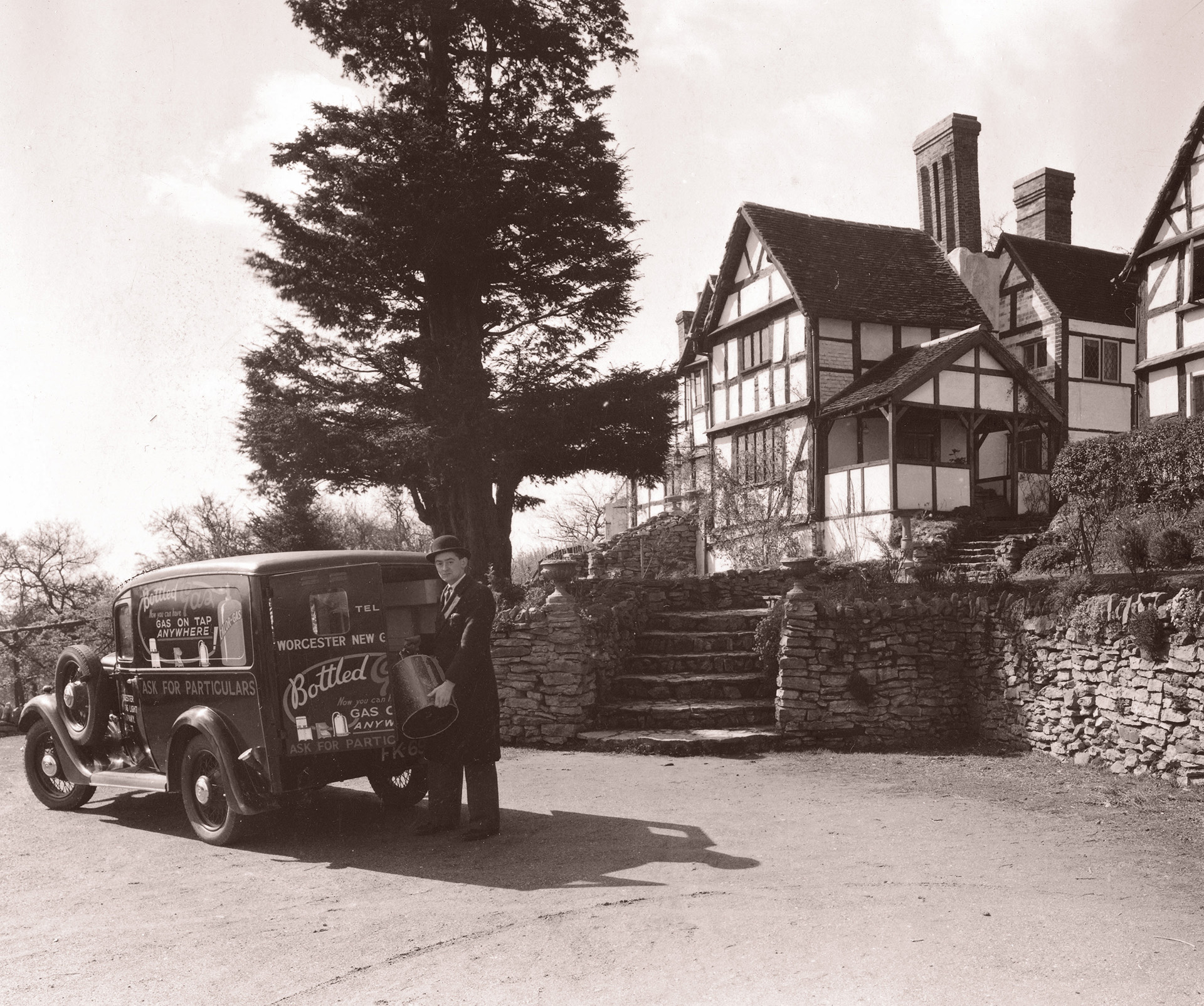 Smartly dressed Mr R.Hill delivers gas to Whitely Manor