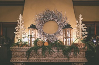 Christmas decorations on a fireplace in a rural home 