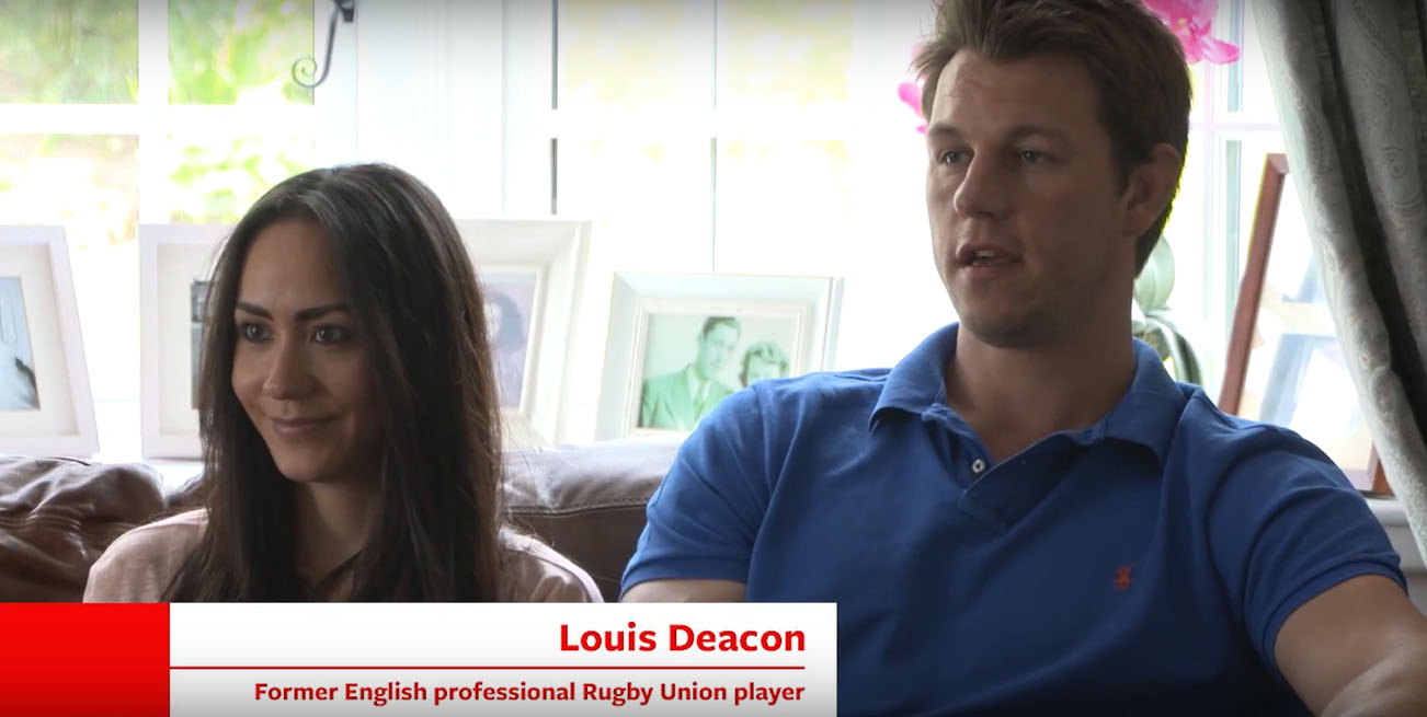 Two of Calor’s customers are sitting down on a sofa in their home. One of the customers is Louis Deacon, a former English professional Rugby Union player
